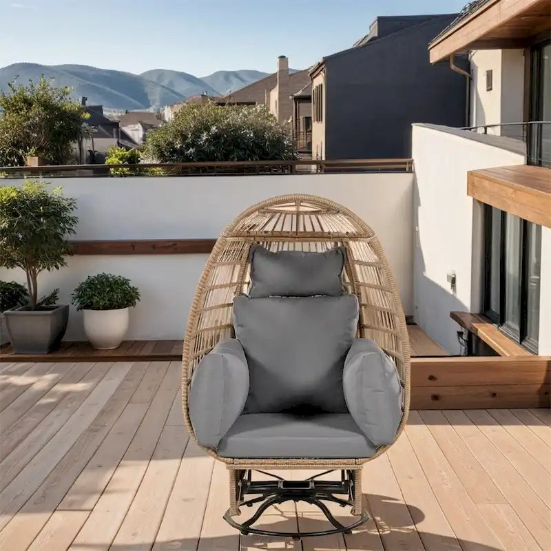 Fauteuil œuf pivotant en rotin avec fonction de bascule et coussins