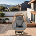 Fauteuil œuf pivotant en rotin avec fonction de bascule et coussins