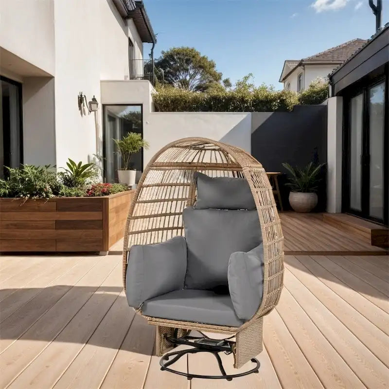 Fauteuil œuf pivotant en rotin avec fonction de bascule et coussins