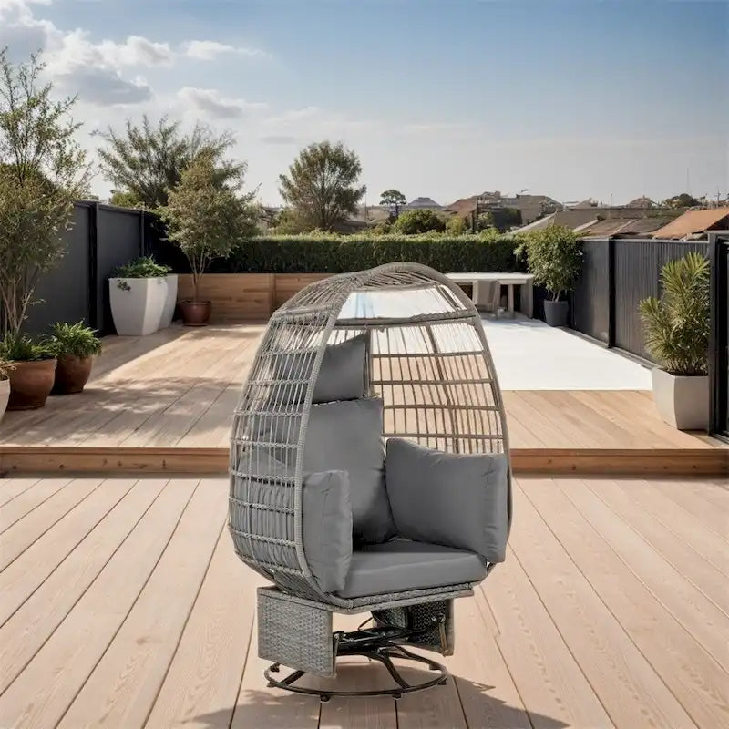 Fauteuil œuf pivotant en rotin avec fonction de bascule et coussins