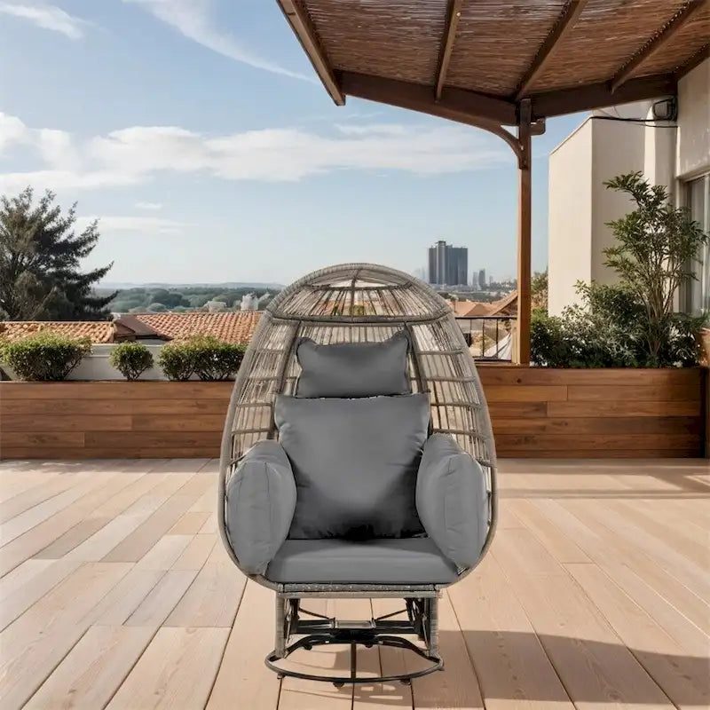 Fauteuil œuf pivotant en rotin avec fonction de bascule et coussins
